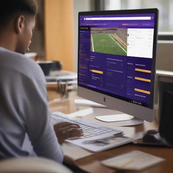 Checking LSU Game Score on Laptop