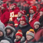 Kansas City Chiefs fans bundled up in cold weather gear at Arrowhead Stadium.