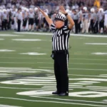 NCAA Football Game Clock Stoppage in Action