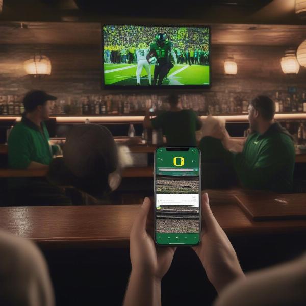 Streaming an Oregon Ducks game on a mobile device and watching at a sports bar