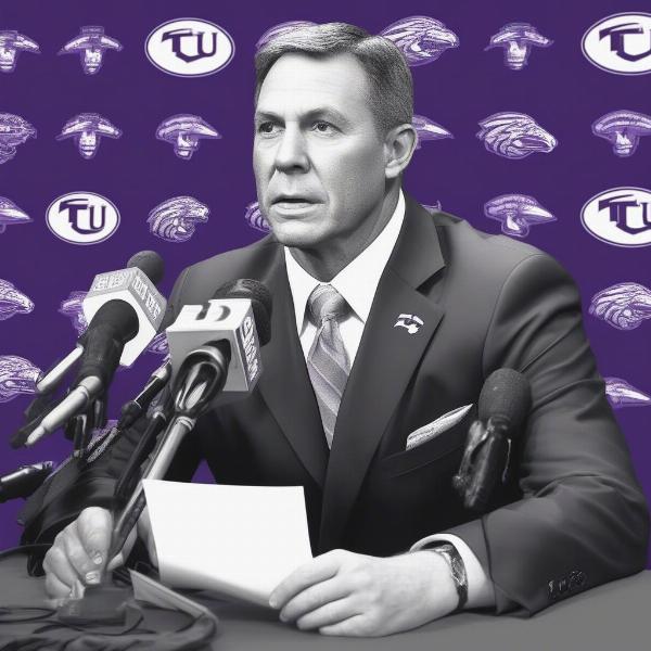 TCU Football Coach Giving a Press Conference